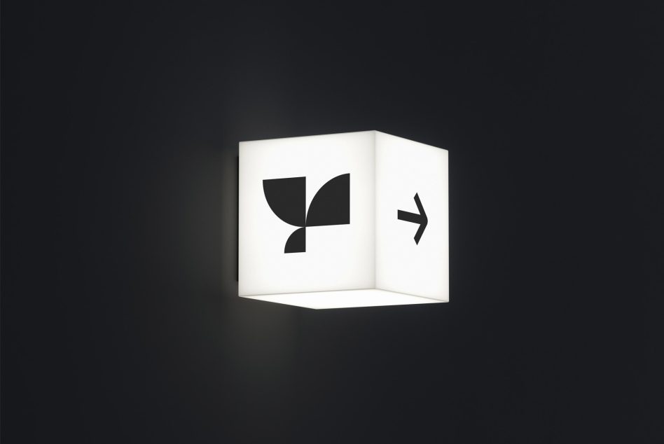 Minimalist cube logo mockup with contrast lighting on a dark background, ideal for brand presentation and design showcases.