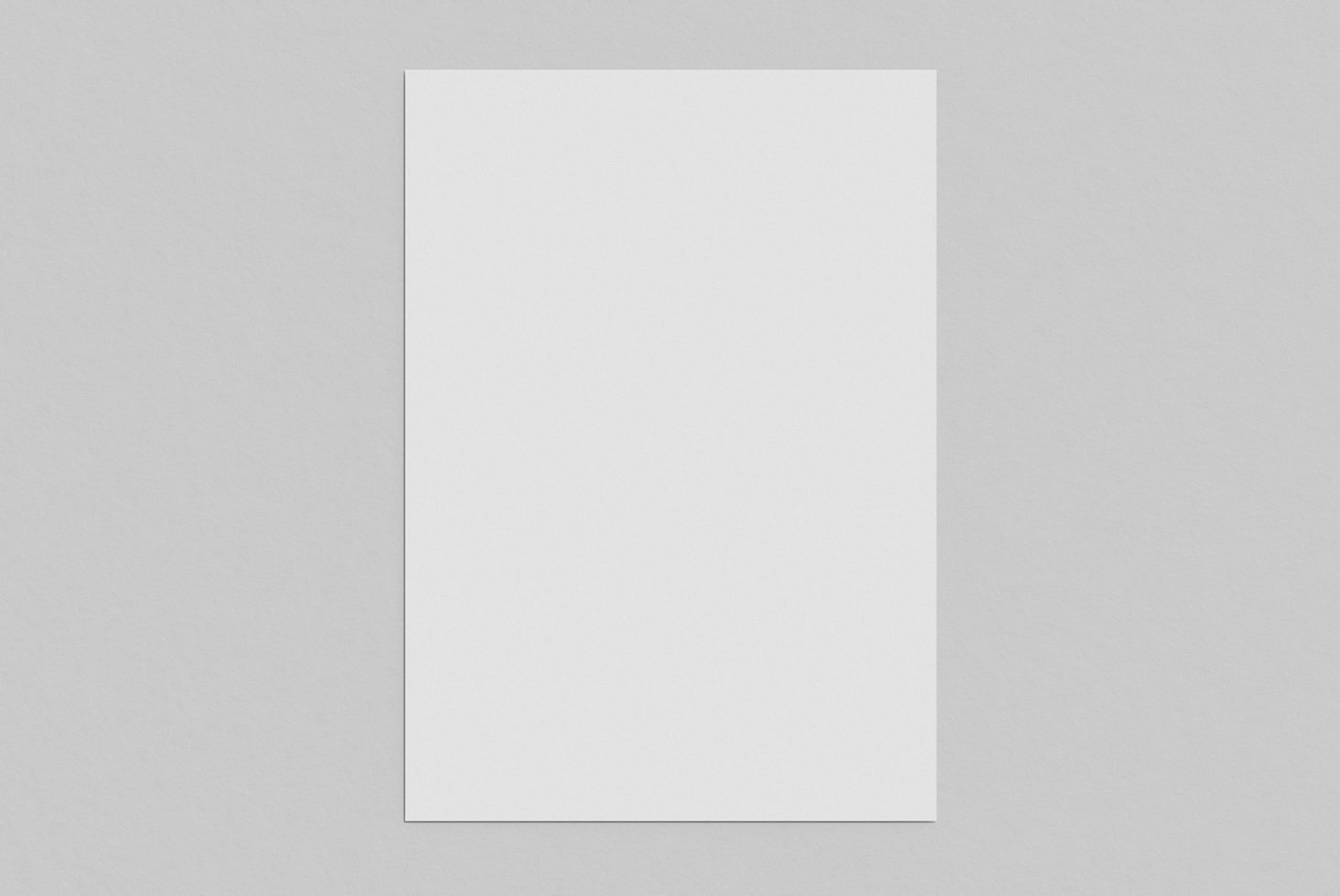 Blank vertical paper mockup with shadow on a plain gray background, ideal for elegant template design presentations. Perfect for digital assets marketplace.