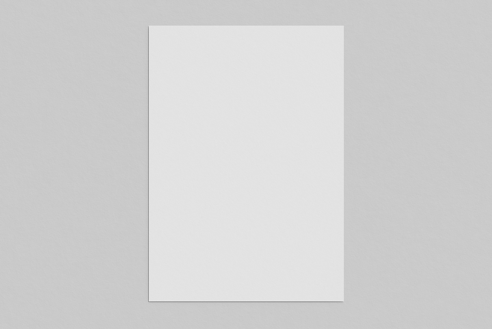 Blank vertical paper mockup with shadow on a plain gray background, ideal for elegant template design presentations. Perfect for digital assets marketplace.