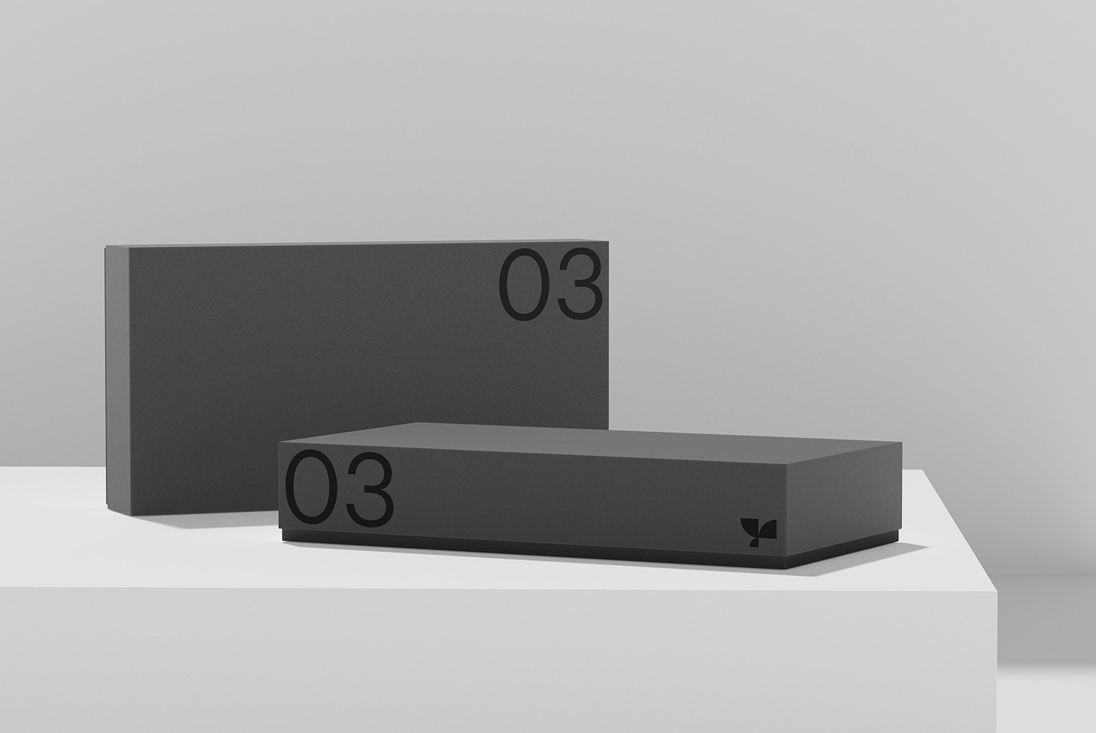 Minimalist black product boxes mockup with number 03 design on neutral background, ideal for packaging design presentation.
