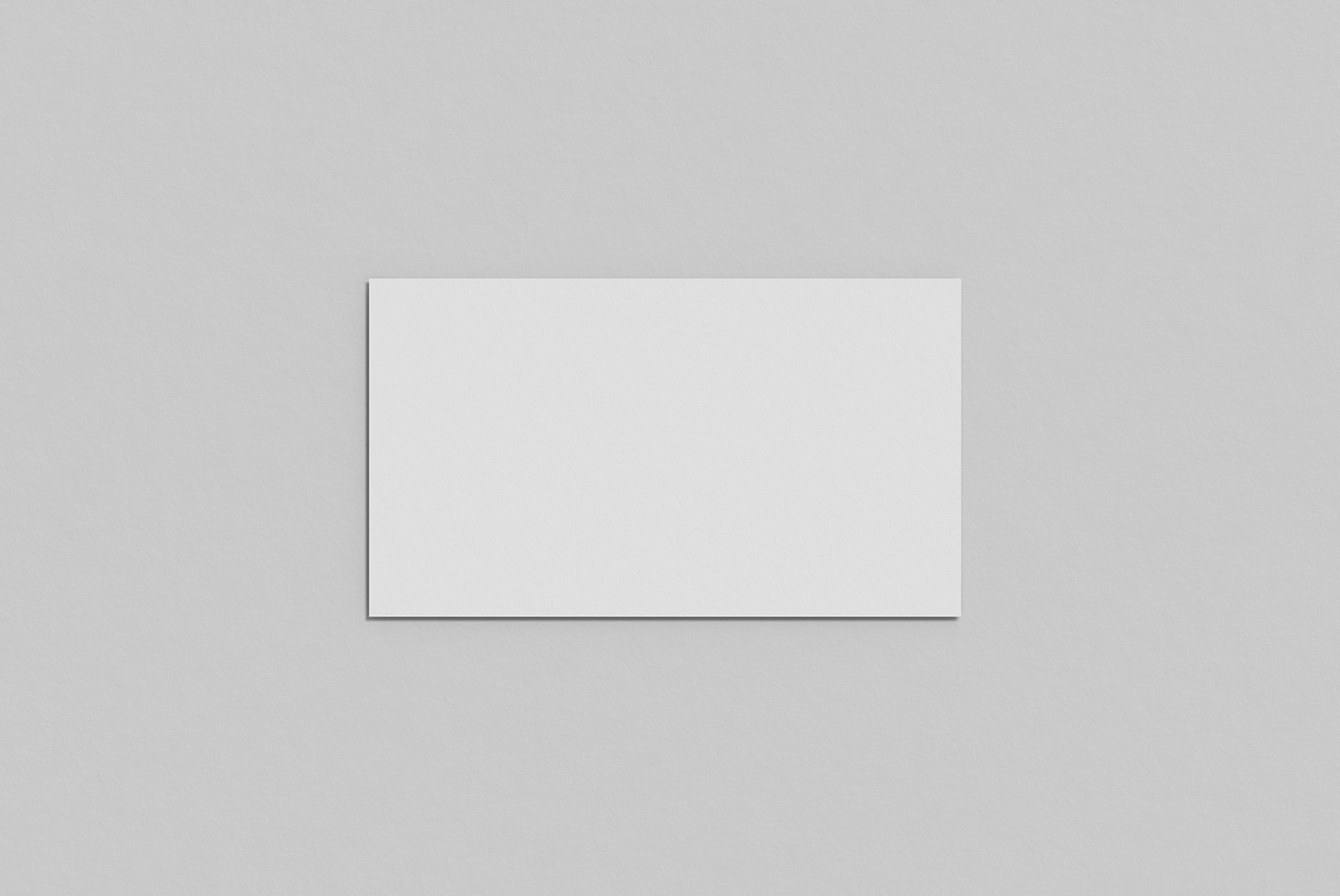 Minimalist blank square paper mockup on a textured grey background for graphic design presentation and portfolio.