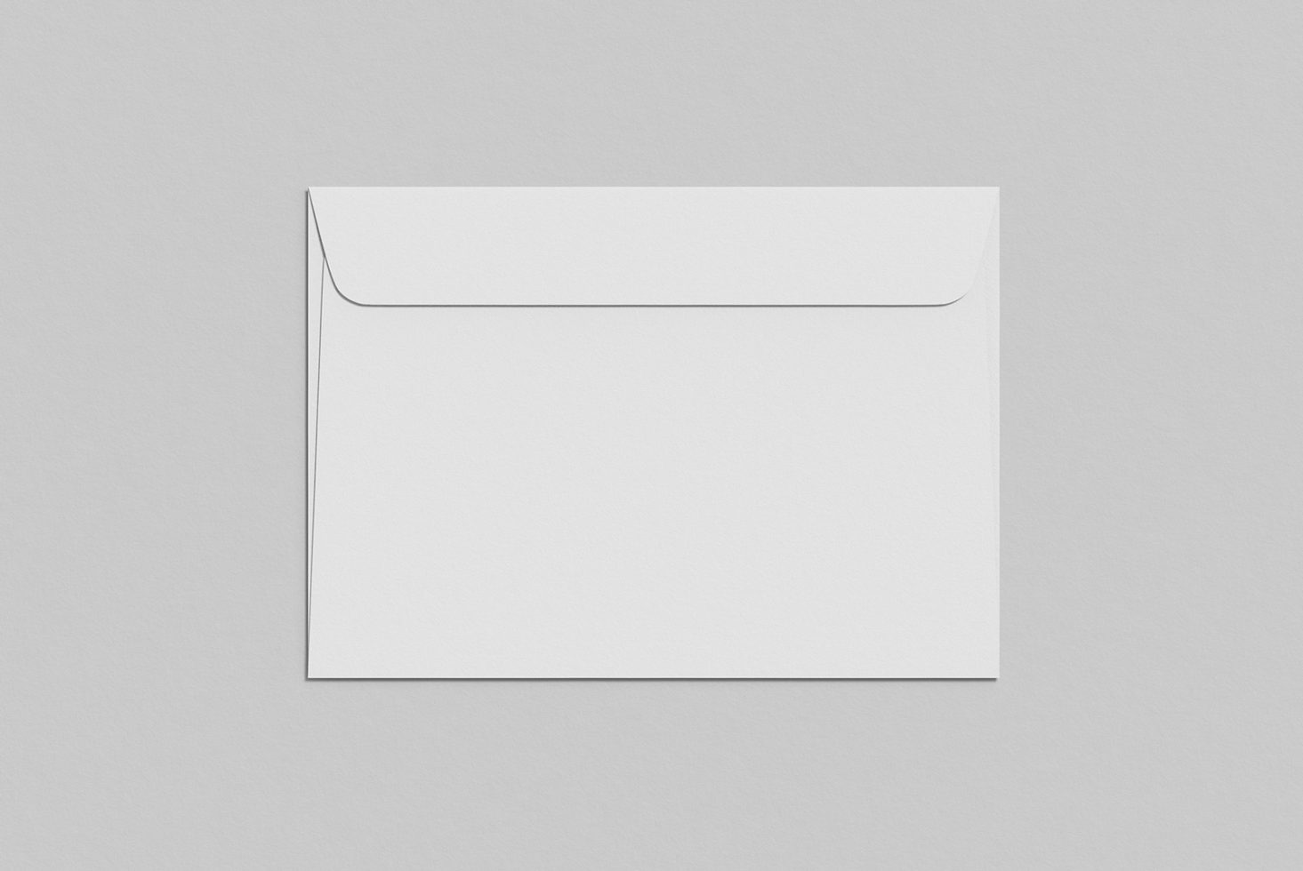 Blank envelope mockup on a grey background, ideal for stationery design presentation, clean and minimalistic.