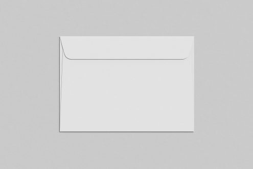 Blank envelope mockup on a grey background, ideal for stationery design presentation, clean and minimalistic.