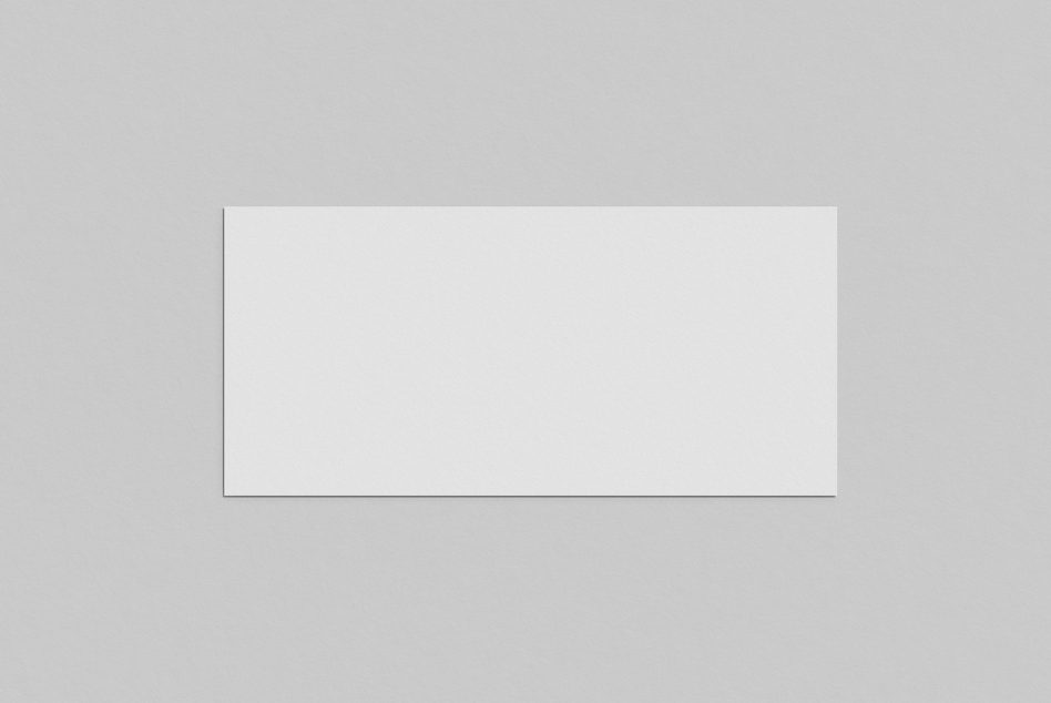 Blank paper card mockup on a textured gray background for presentation of designs and graphics.