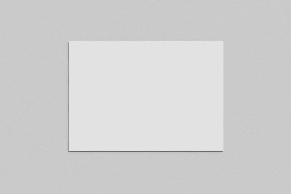 Minimalist white square paper mockup on a textured grey background, ideal for sleek design presentations and branding.