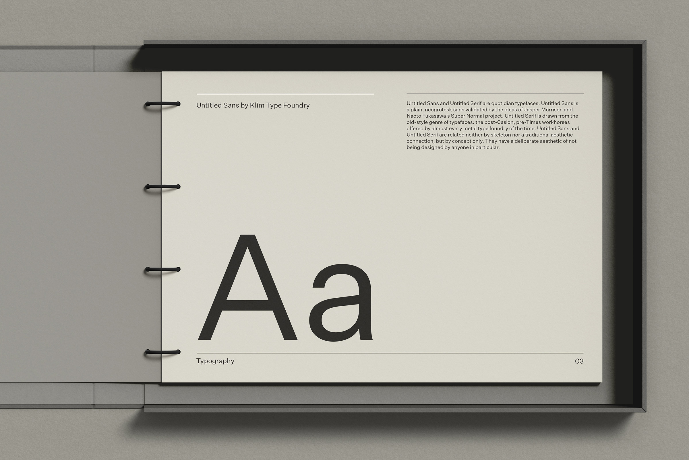 Elegant font presentation in a flipbook, showcasing large and small letters Aa with descriptive text, ideal for design mockups and typography.