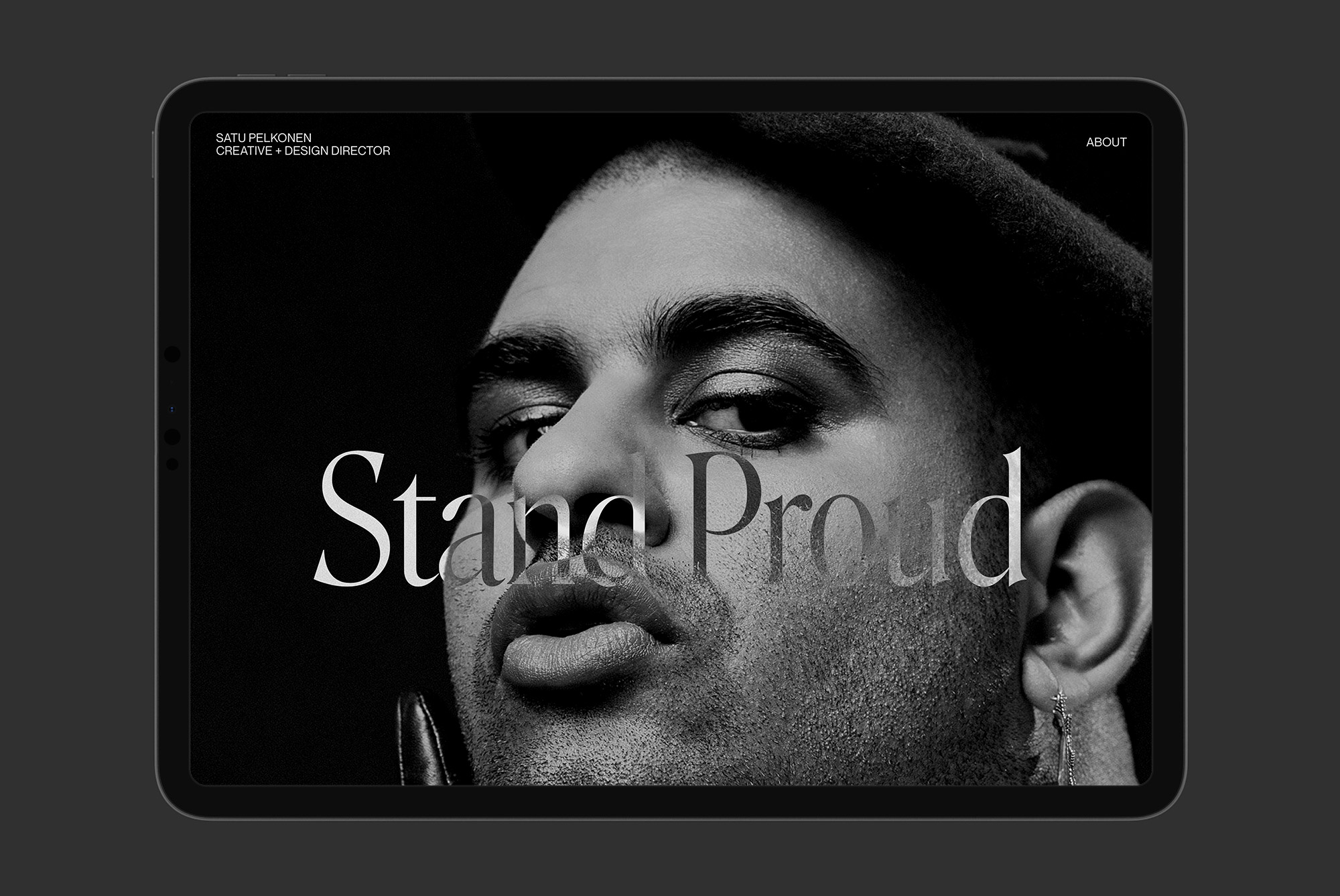 Black and white photo of a person's face on a tablet showcasing bold typography template design for modern branding mockup.