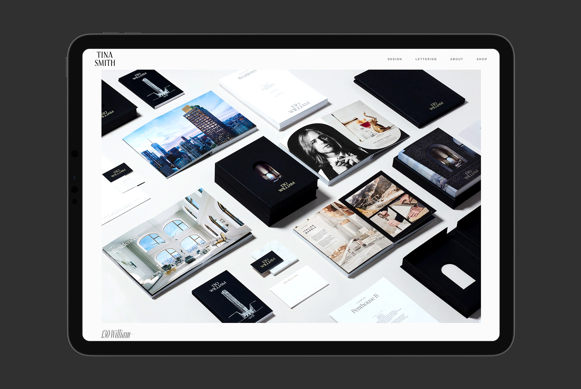 Portfolio website design mockup displayed on a tablet showing a collection of branding materials, stationery, and creative layouts for designers.