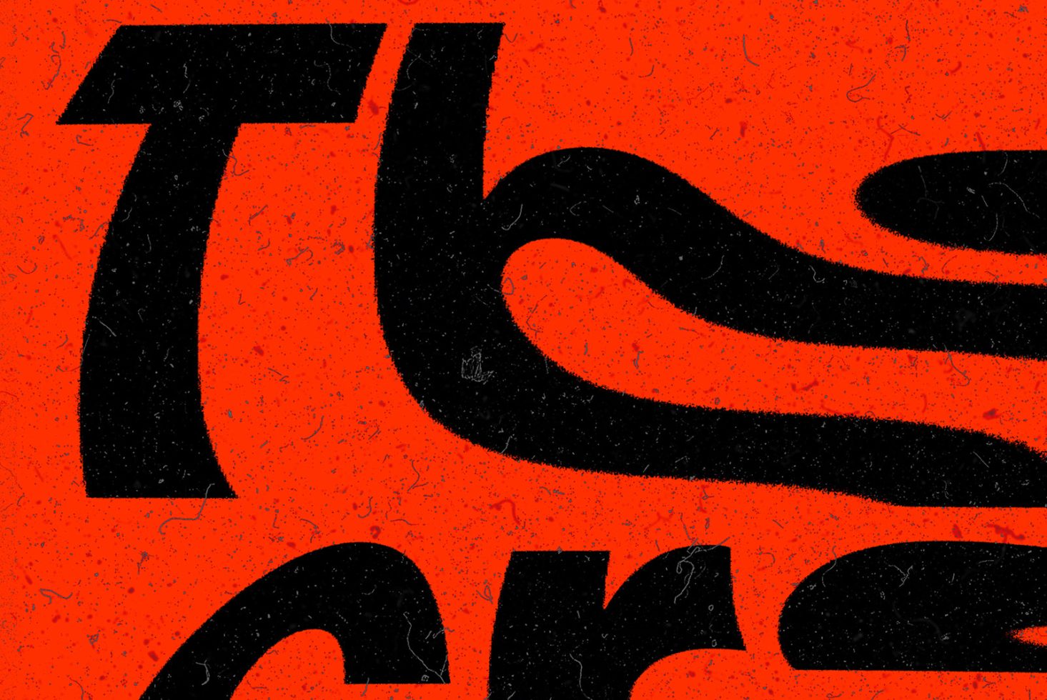 Close-up view of bold stylized font design, modern typography, textured on red background for graphic design assets.