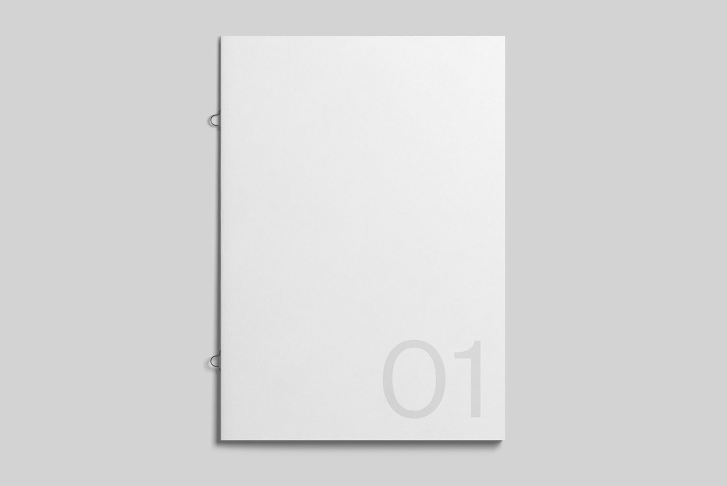 White wire-bound notebook with subtle 01 numbering, corner detail view