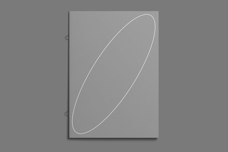 Minimalist closed brochure or booklet mockup in grayscale with elastic band on a gray background, ideal for presentations and branding.