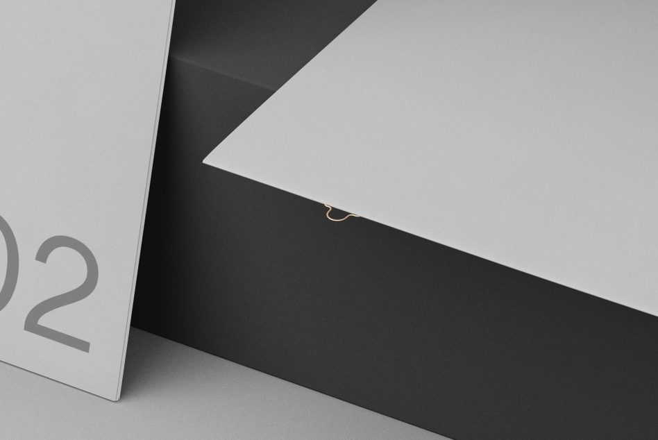 Elegant black and white paper folder mockup design with metallic clasp detail for presentation and portfolio showcase.