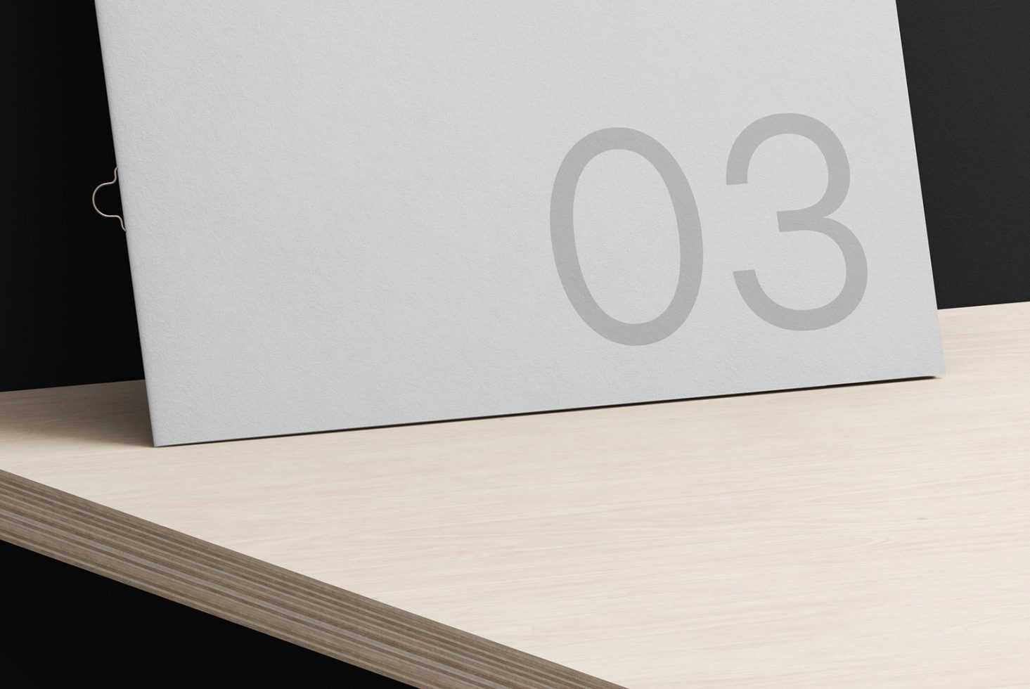 Clean minimalist number 03 design on gray portfolio mockup with black and wooden textures, perfect for showcasing graphic design work.