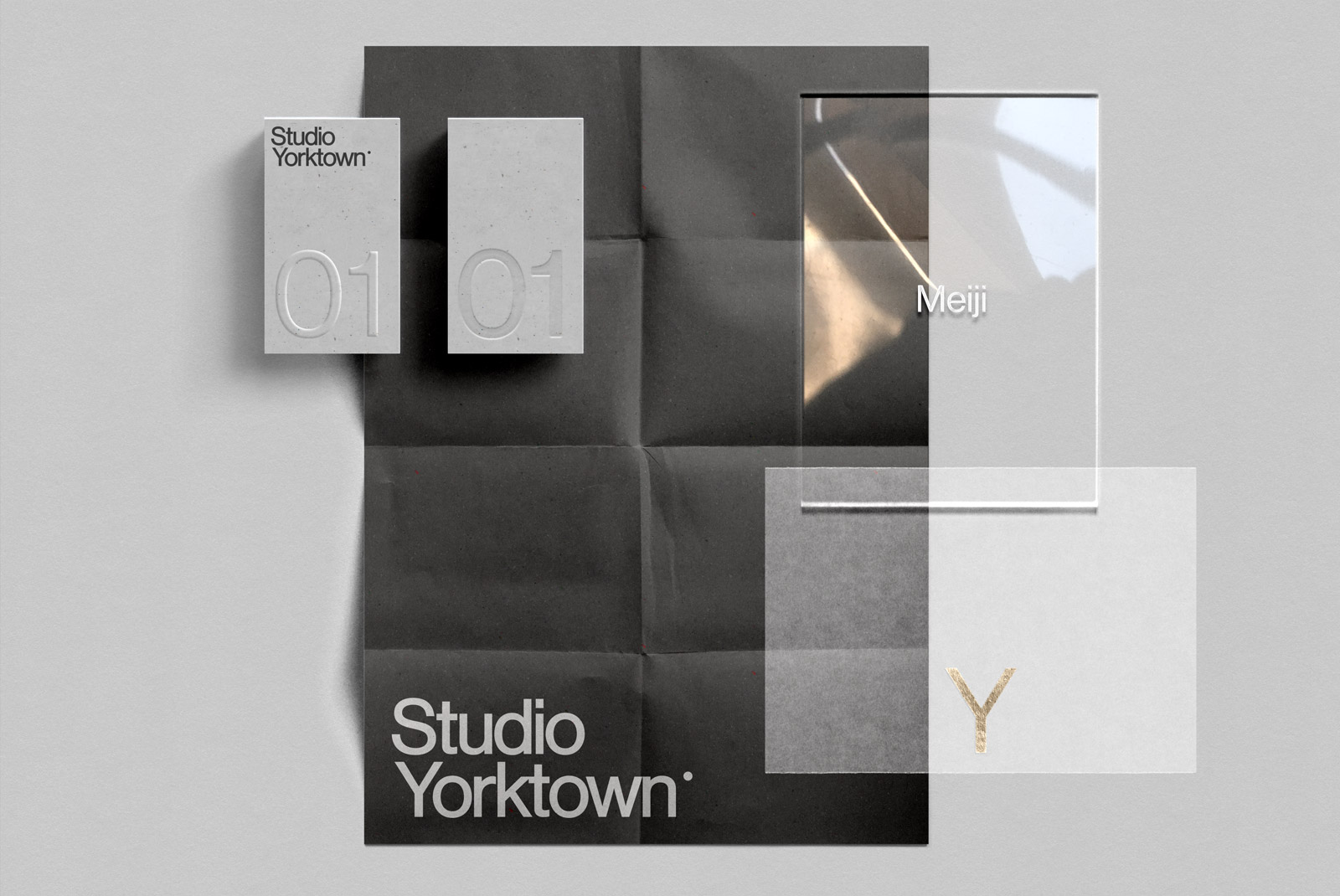 Stylish stationery mockup with business cards and textured papers displaying Studio Yorktown brand, ideal for design presentations.