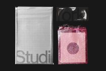 White bubble mailer mockup left, pink bubble envelope mockup right on black