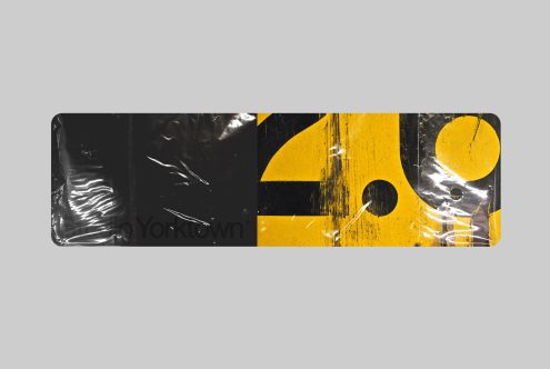 Grunge style banner graphic with black and yellow abstract design elements, distressed textures, and typographic detail for creative projects.