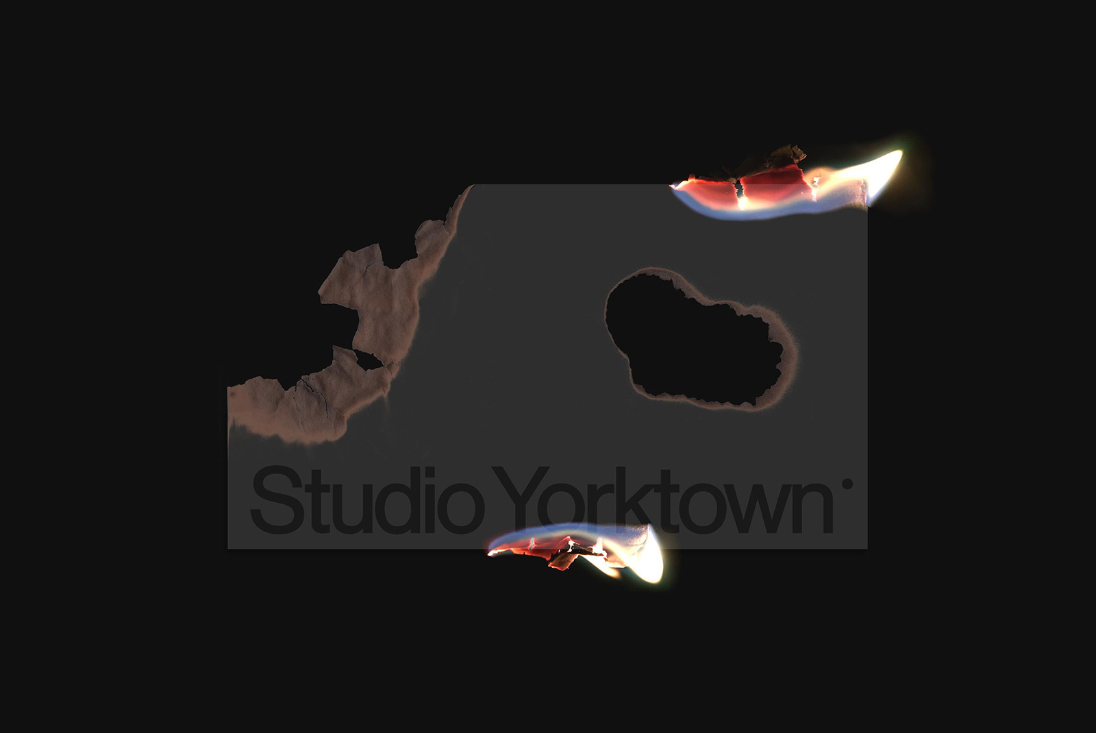 Creative paper burn effect mockup with dynamic flame textures highlighting the Studio Yorktown logo, ideal for presentations, digital art.