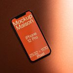 Smartphone screen mockup on an orange background displaying design resolution specs, ideal for designers looking to showcase apps or web designs.