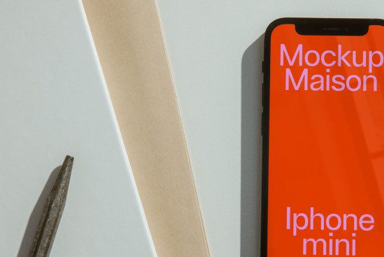 Smartphone on a desk with a colorful screen and text, ideal for a modern mockup, design presentation, or branding showcase.