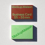 Business card mockup featuring two cards with shadows on a textured surface, ideal for presentation, design assets.