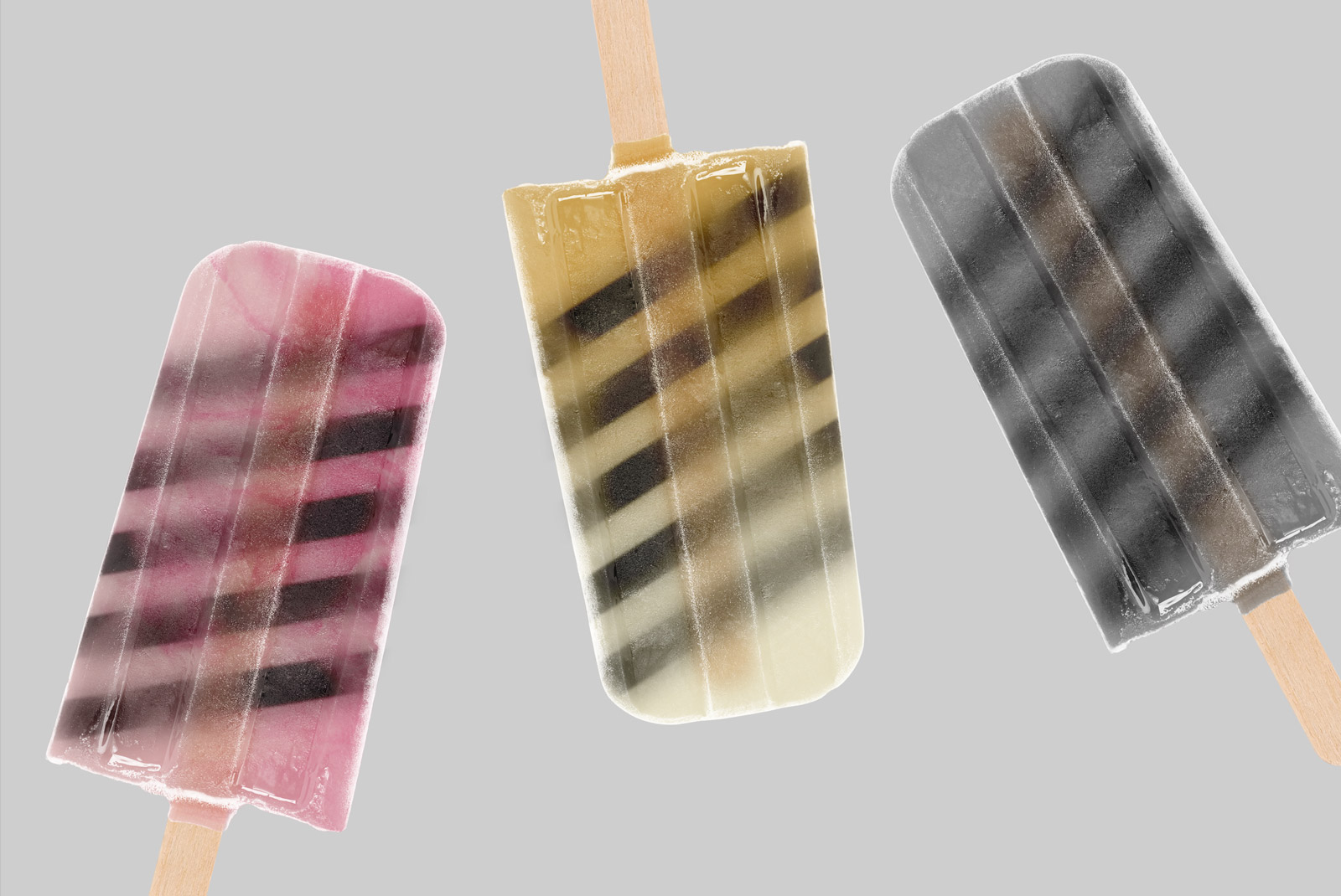 Realistic popsicle mockups with transparent background, featuring three flavors, ideal for food-related graphic design.