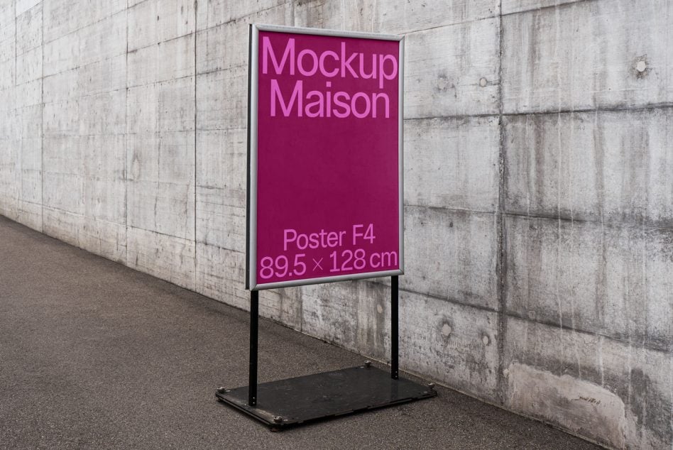 Pink poster on metal stand against rough concrete wall, displays F4 poster specs