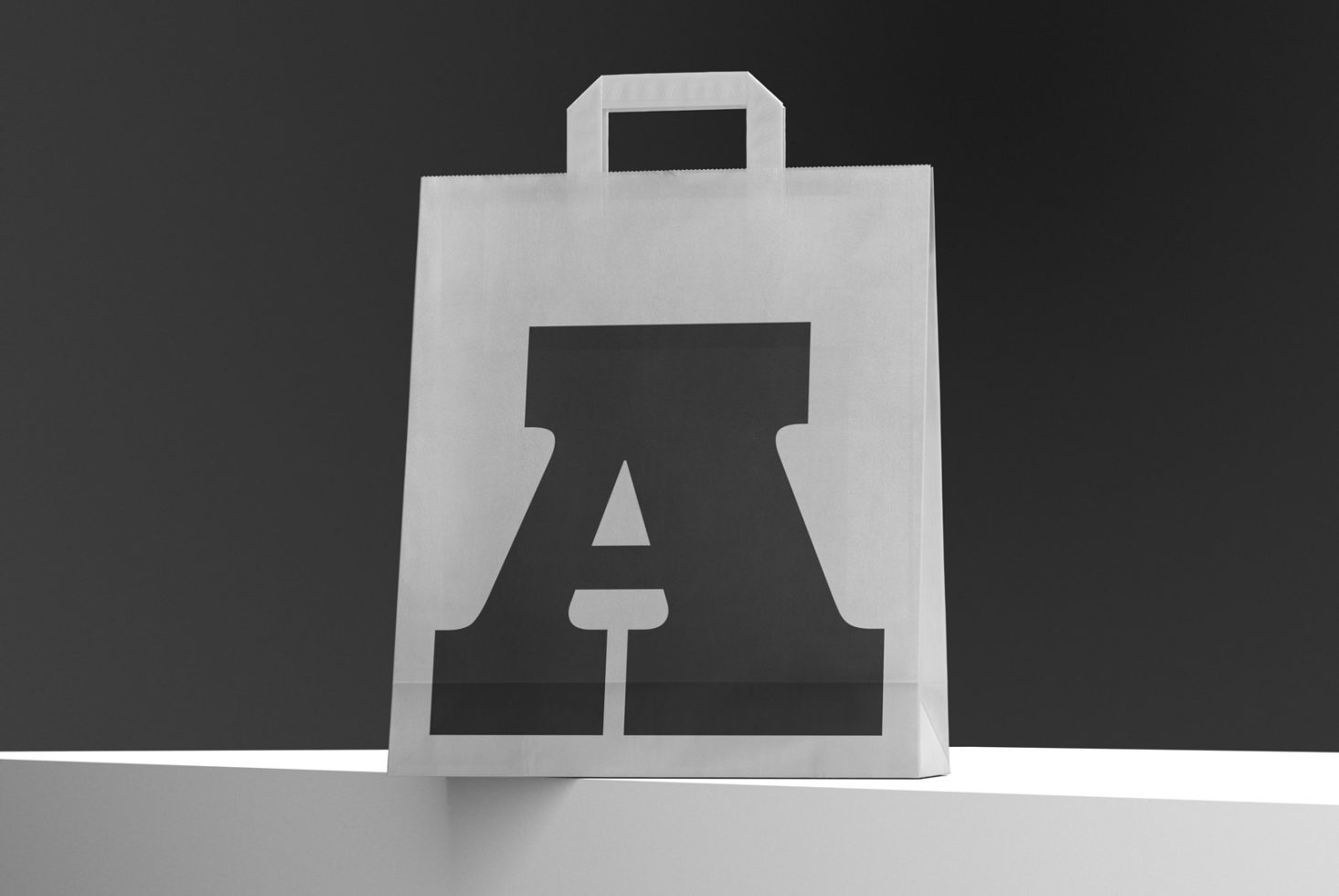 Elegant tote bag mockup with iconic bell-bottom trouser shape design on shelf, perfect for showcasing fashion branding graphics.