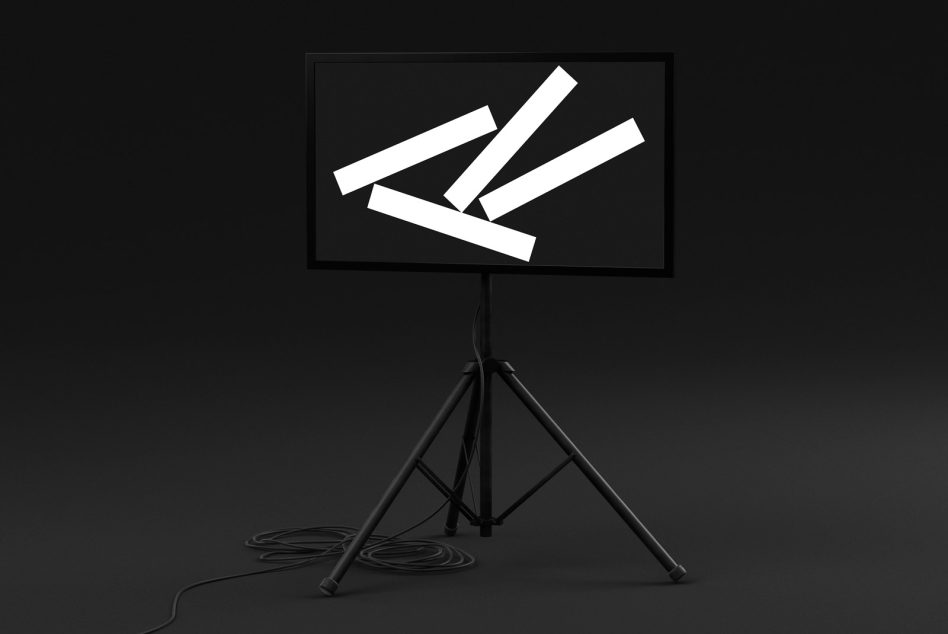 Tripod stand with monitor displaying white diagonal lines on black screen