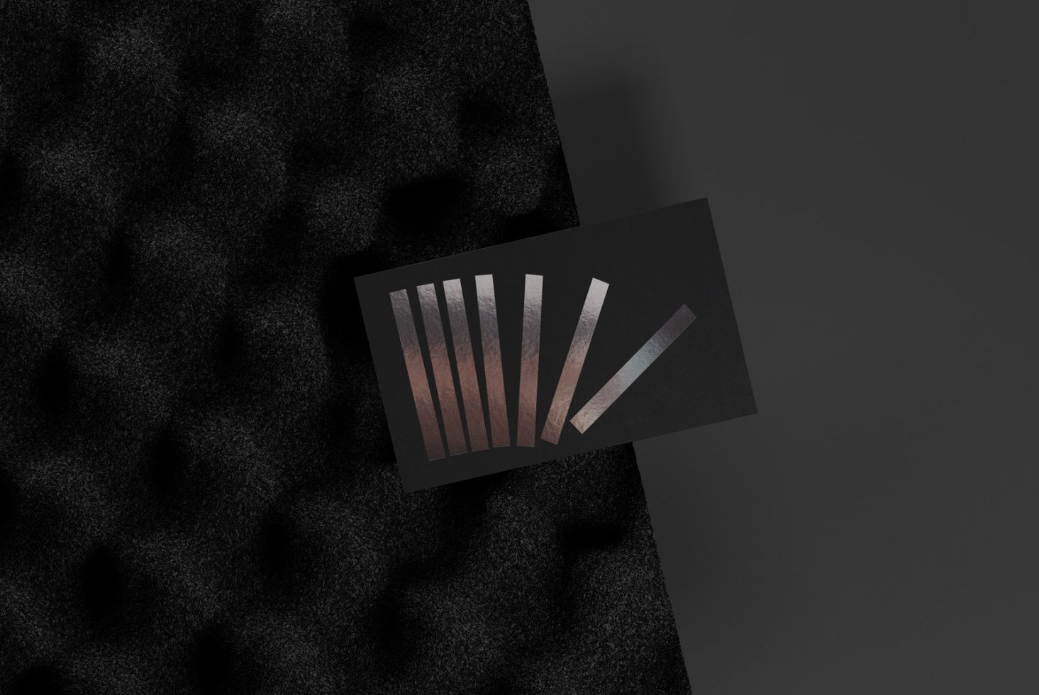 Elegant business card mockup with textured design on a dark surface, perfect for stylish branding presentations and design showcases.