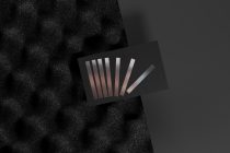 Color swatch fan on dark card with textured fabric backdrop