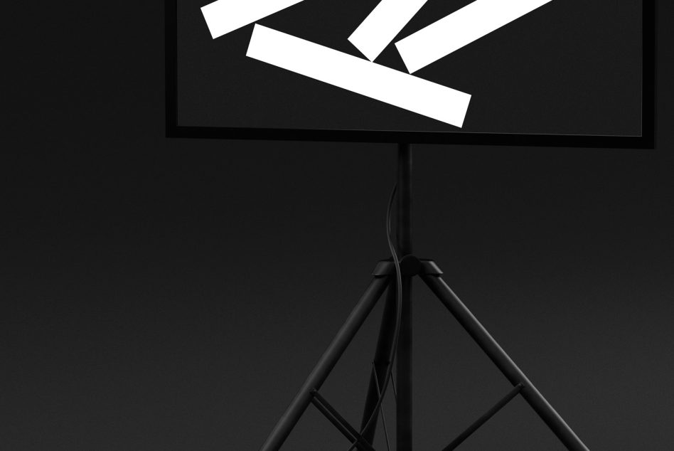 Movie clapperboard on tripod stand against dark background