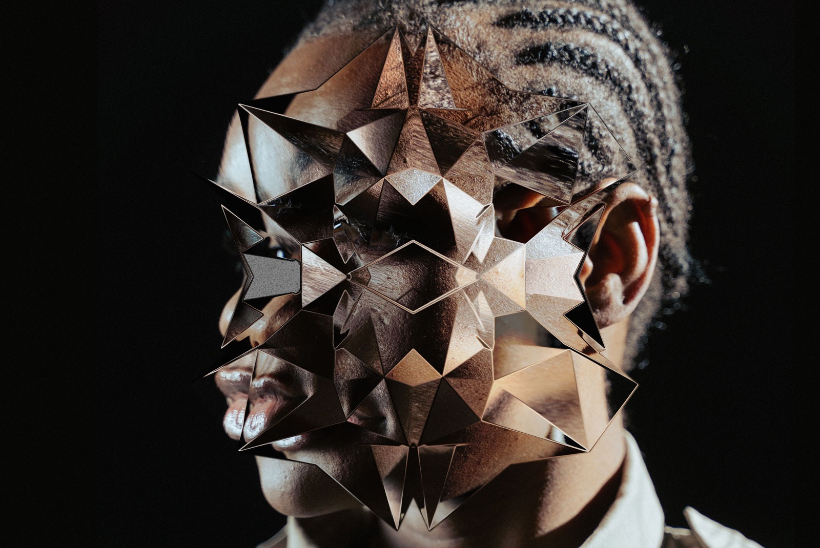 Person wearing a geometric metallic mask, artistic portrait, ideal for mockups or graphics for avant-garde design concepts.