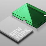 Hardcover book mockup with removable jacket, clean design, titled New York, in gray, with green translucent slipcase, ideal for presentations.