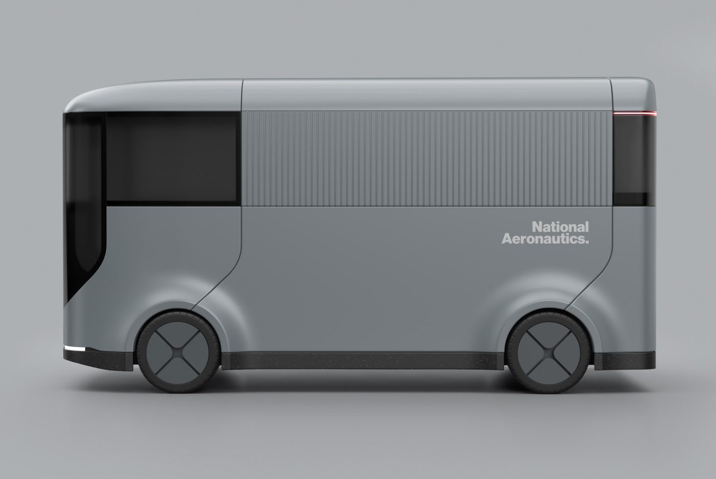 Futuristic electric bus concept design mockup showing the side view, with a sleek grey body and minimalist branding ideal for vehicle templates.