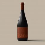 Elegant wine bottle mockup on beige background for product display, packaging mockups, and label design presentations for designers.