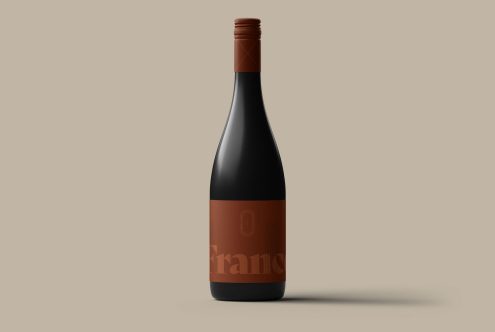 Elegant wine bottle mockup on beige background for product display, packaging mockups, and label design presentations for designers.