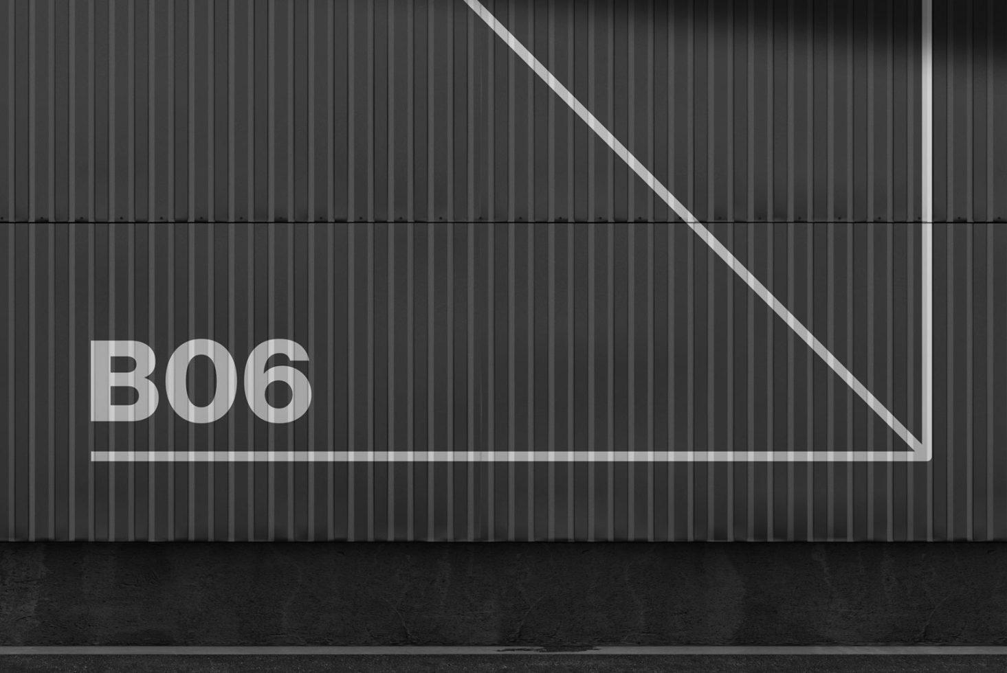 Modern industrial container wall with diagonal line and B06 text, ideal for mockup backgrounds or graphic design elements.