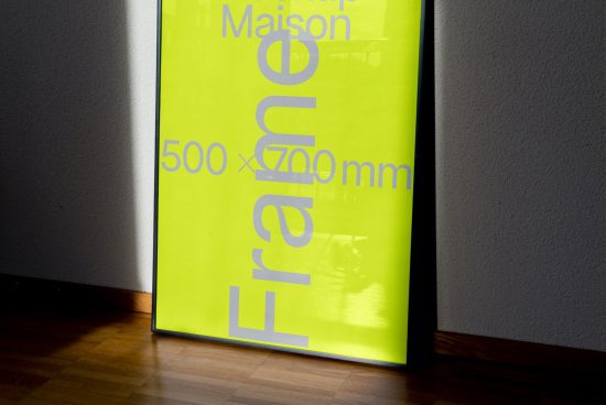 Bright yellow poster with bold typography mockup leaning against a wall, partial sunlight and shadow, graphic design and presentation.