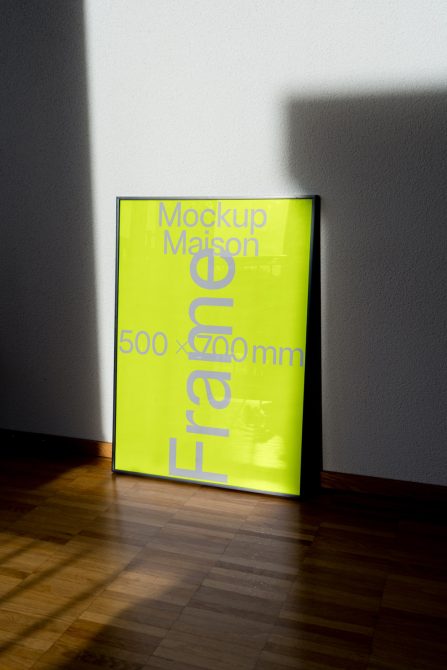 Bright neon green poster mockup leaning against a wall with contrasting shadows, ideal for graphic design presentations.