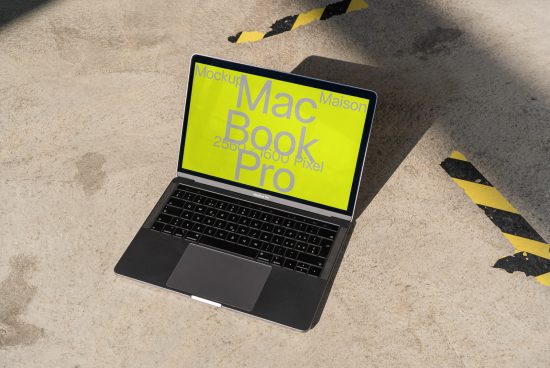Laptop mockup with yellow screen for design presentation on textured background, great for graphics display showcase.