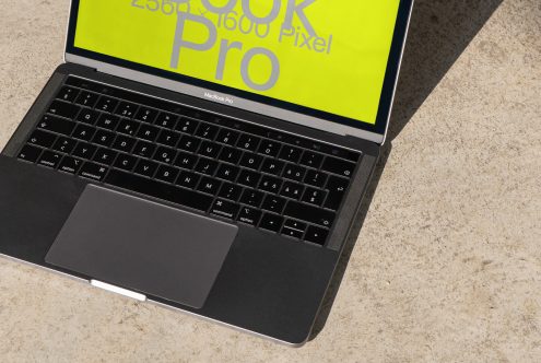 Laptop with high-resolution display mockup in sunlight, tech product presentation for digital design, content creation asset.