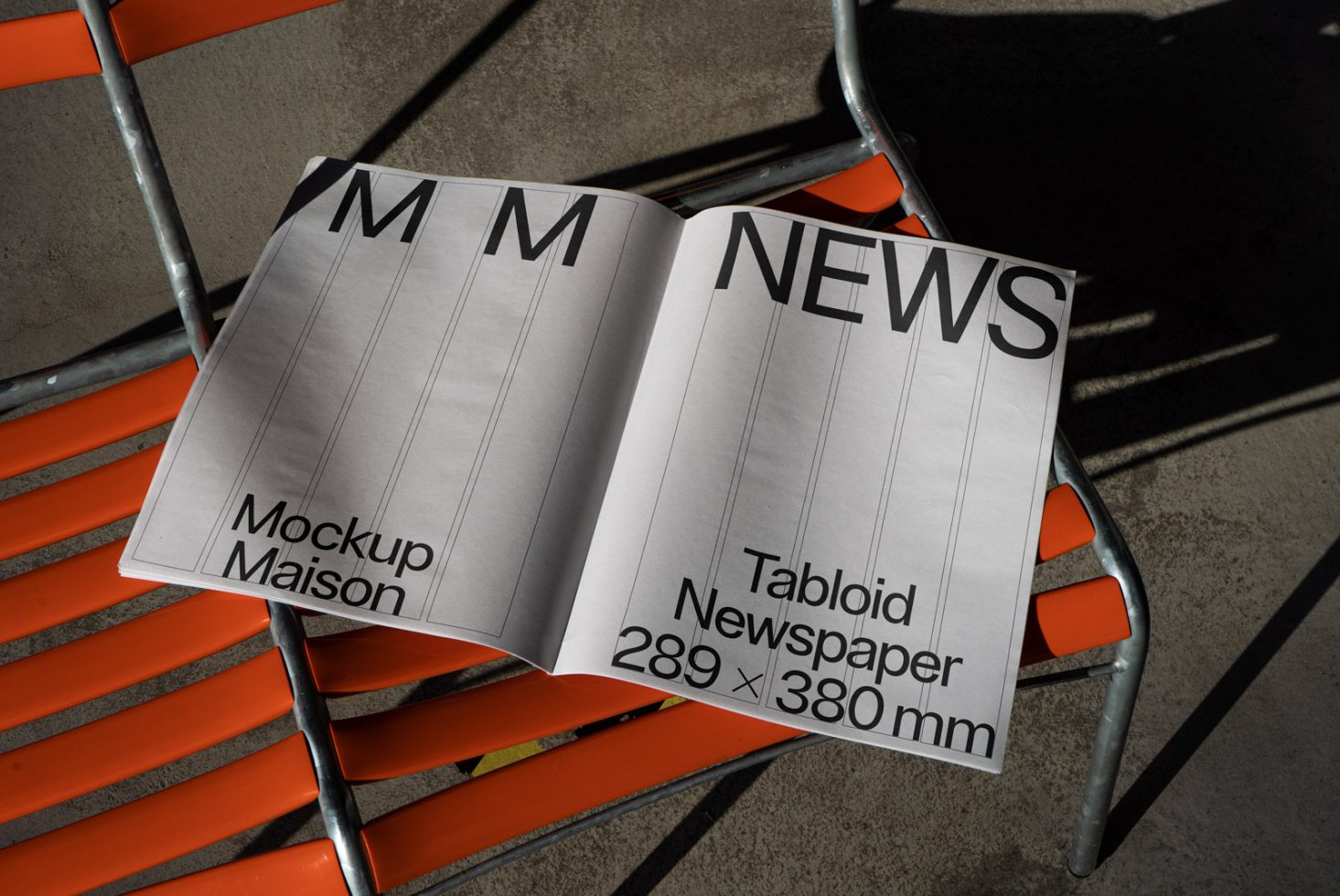 Editable tabloid newspaper mockup on orange chair, showcasing layout design in natural lighting, dimensions displayed for designers.