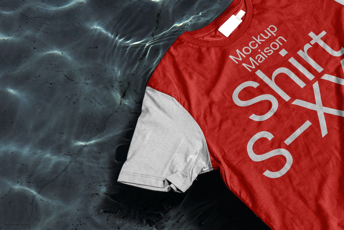 Red and gray t-shirt mockup on textured water background, ideal for fashion designers to display their graphics and designs.