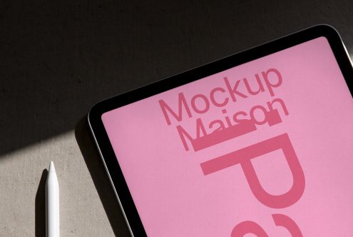 Tablet screen mockup with stylus, showcasing digital asset Mockup Maison in a realistic environment, ideal for designers, branding presentations.