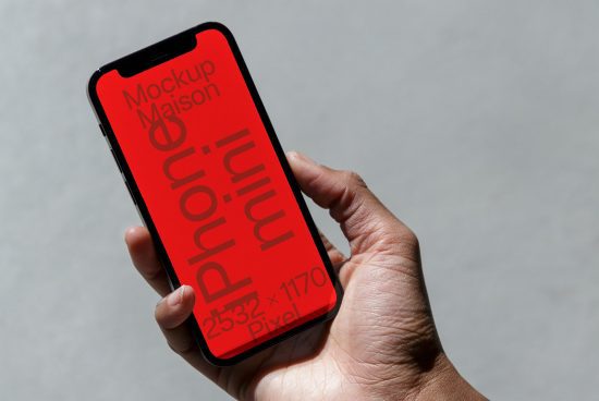 Hand holding smartphone with red screen mockup for design presentation, clear typography, high resolution display, modern mobile mockup.