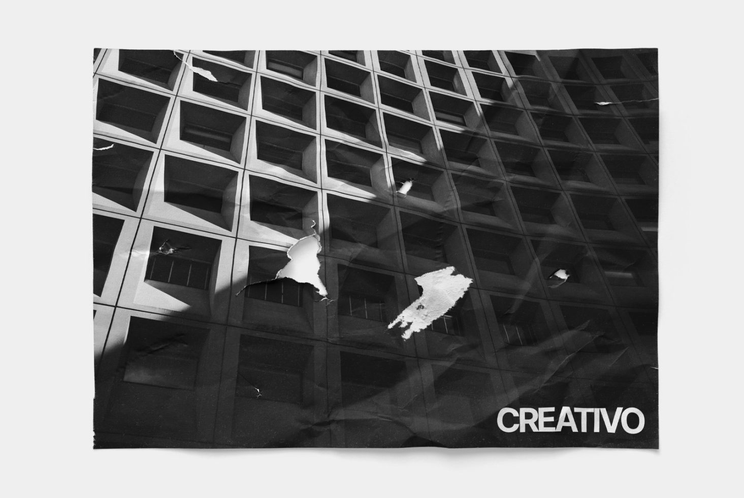 Abstract black and white graphic with distorted urban facade pattern and bold CREATIVO text, ideal for avant-garde design templates.