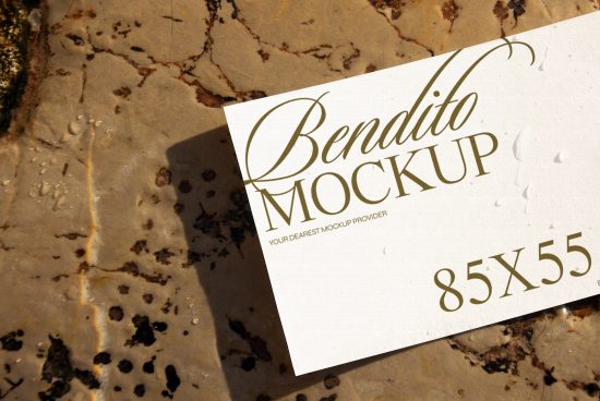 Business card mockup on a marble surface with elegant typography and natural shadows, perfect for designers to showcase branding designs.