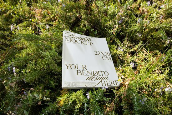 Magazine mockup lying on green foliage, natural setting, editable design template for presentations, 23x30 cm size.