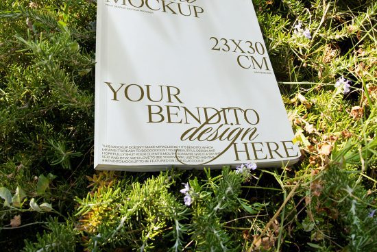 Outdoor magazine mockup template lying in greenery for graphic designers, editable PSD, high resolution, nature backdrop, presentation tool.