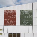 Two poster mockups displayed on a modern building exterior for showcasing design works, with clear sky background, ideal for graphic designers.